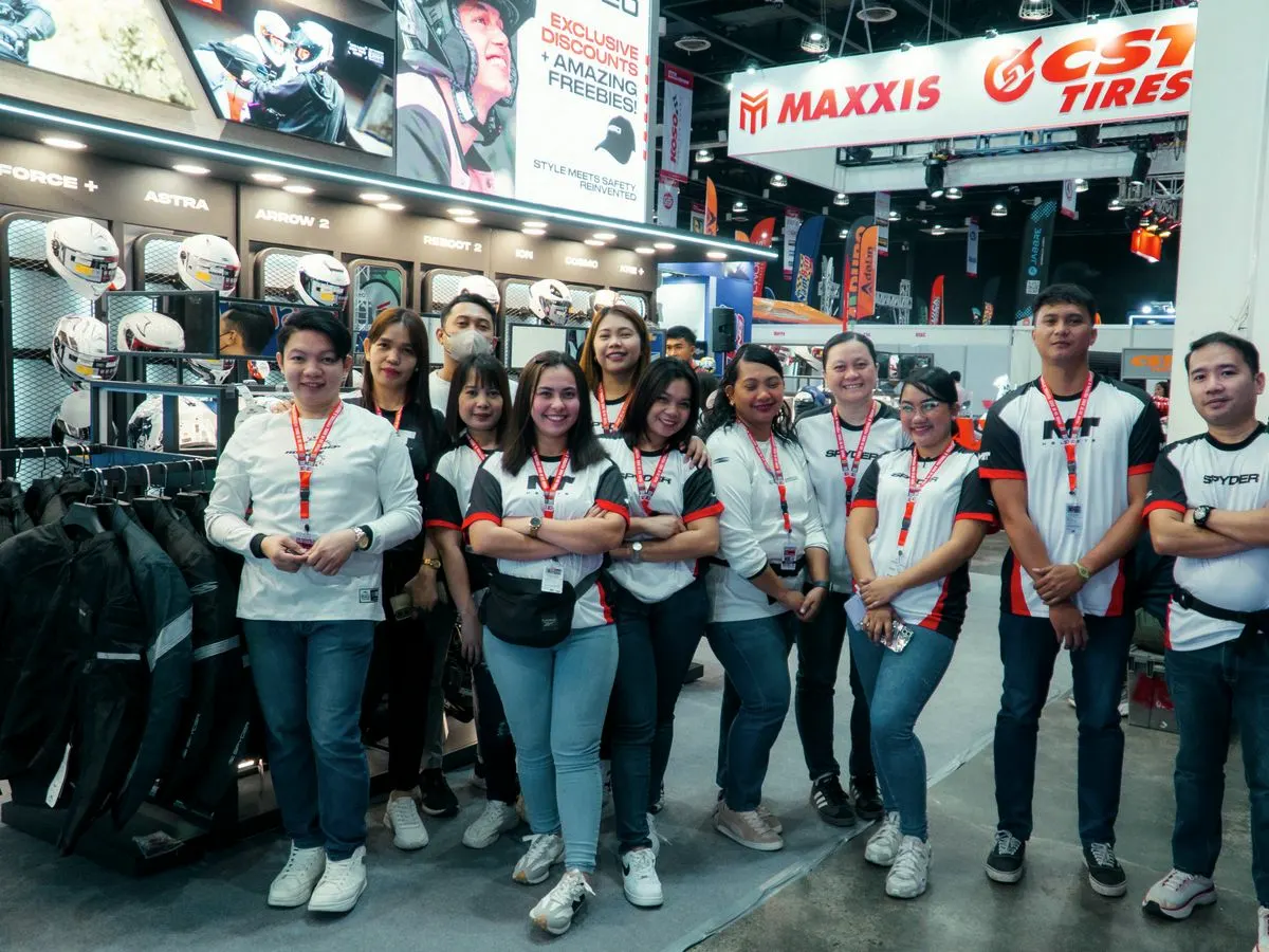 The expo crew in uniform at a motorcycle show