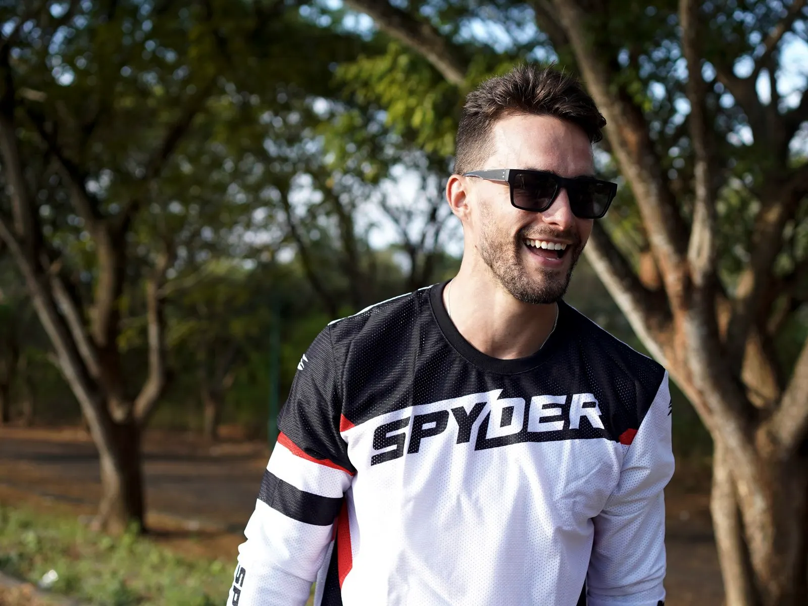 A rider in a Spyder jersey and dark sunglasses: eyewear, where the business began in 1994