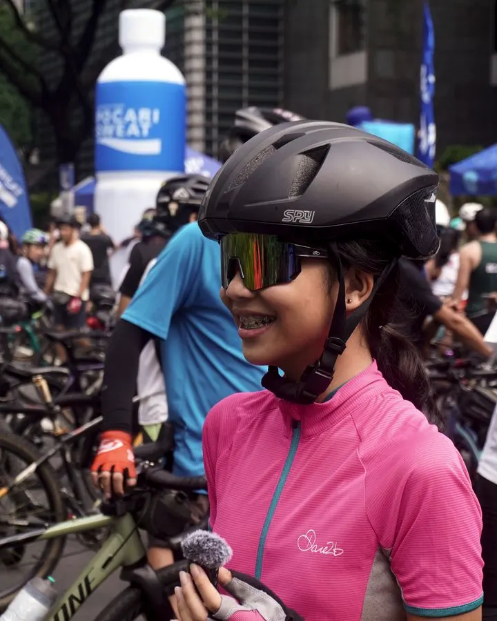 A rider in a Spyder helmet at a cycling event