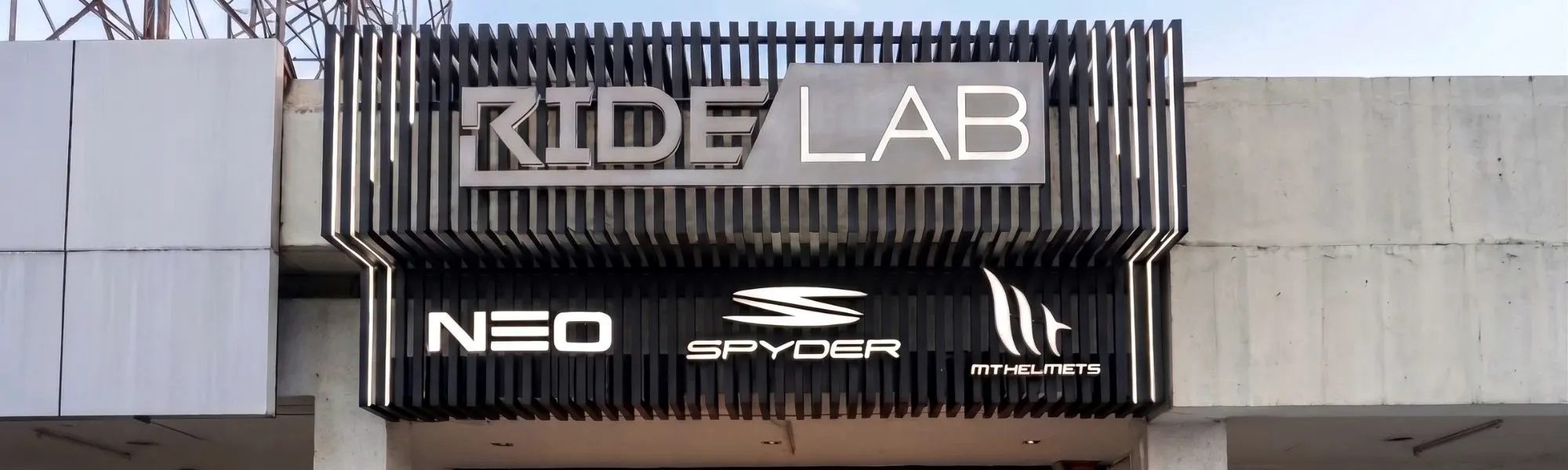 The RideLab flagship sign, with Neo, Spyder and MT Helmets beneath it